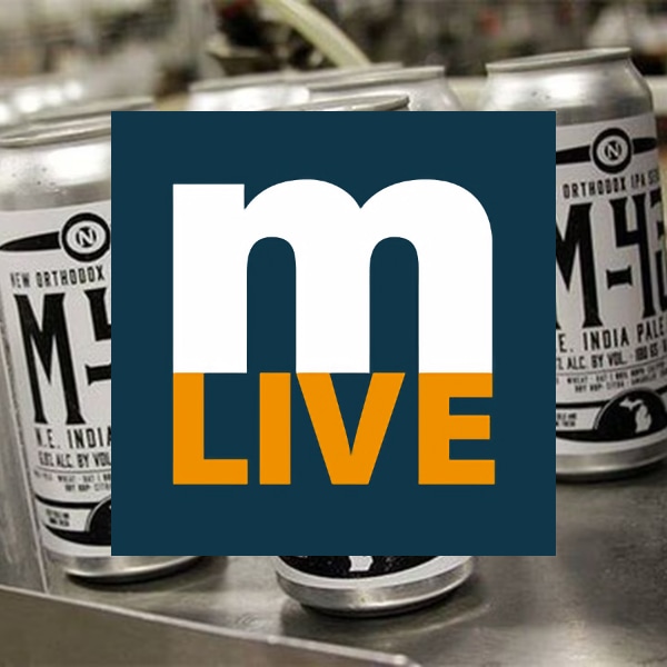 mlive logo with Old Nation M-43 cans in background
